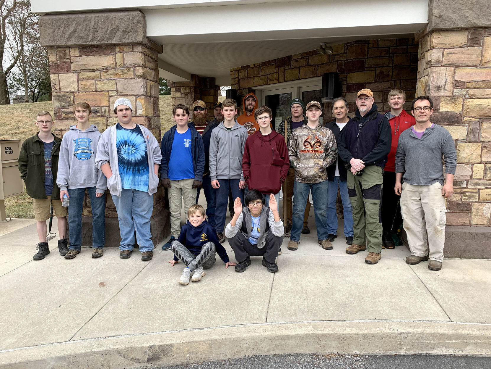Scouts spend time sprucing up library grounds